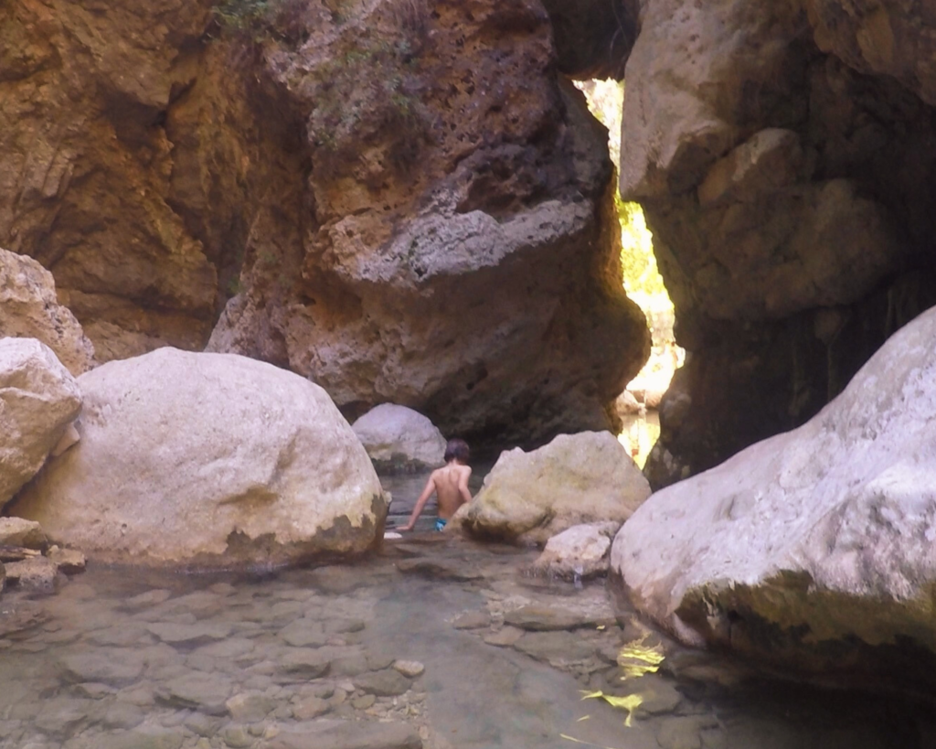 walking through the rocks of nidri waterfall