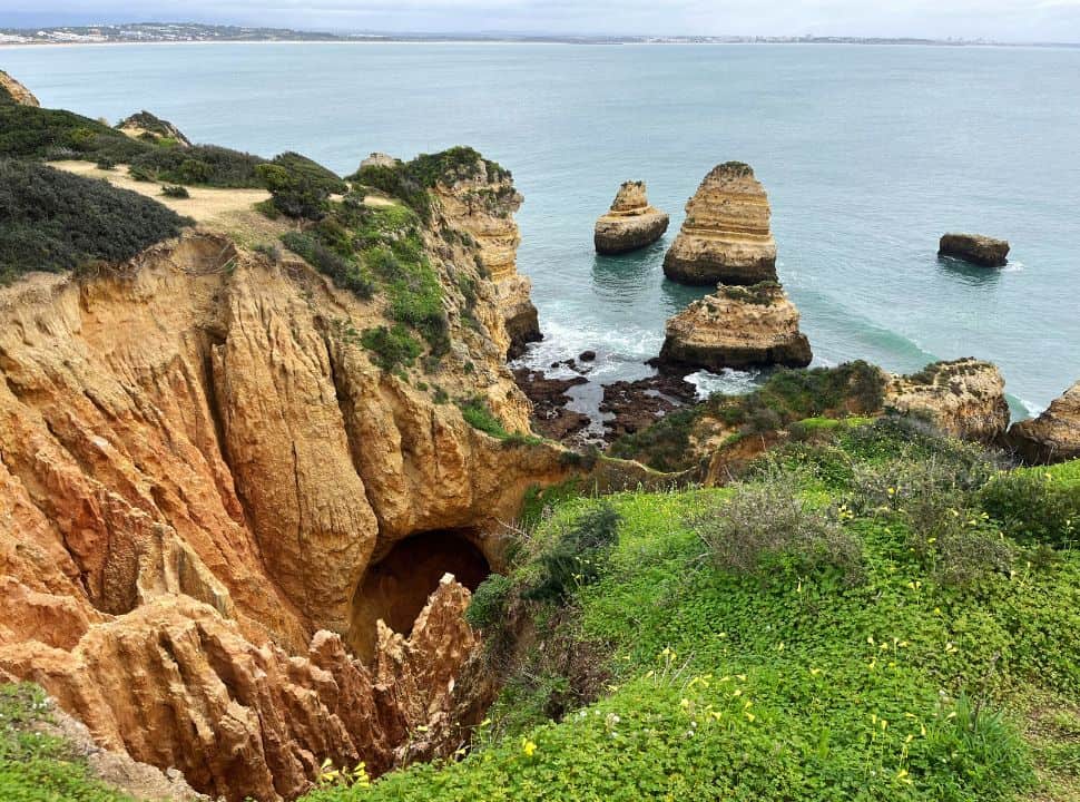 rock formations and towers along and in the water at the algarve coast
