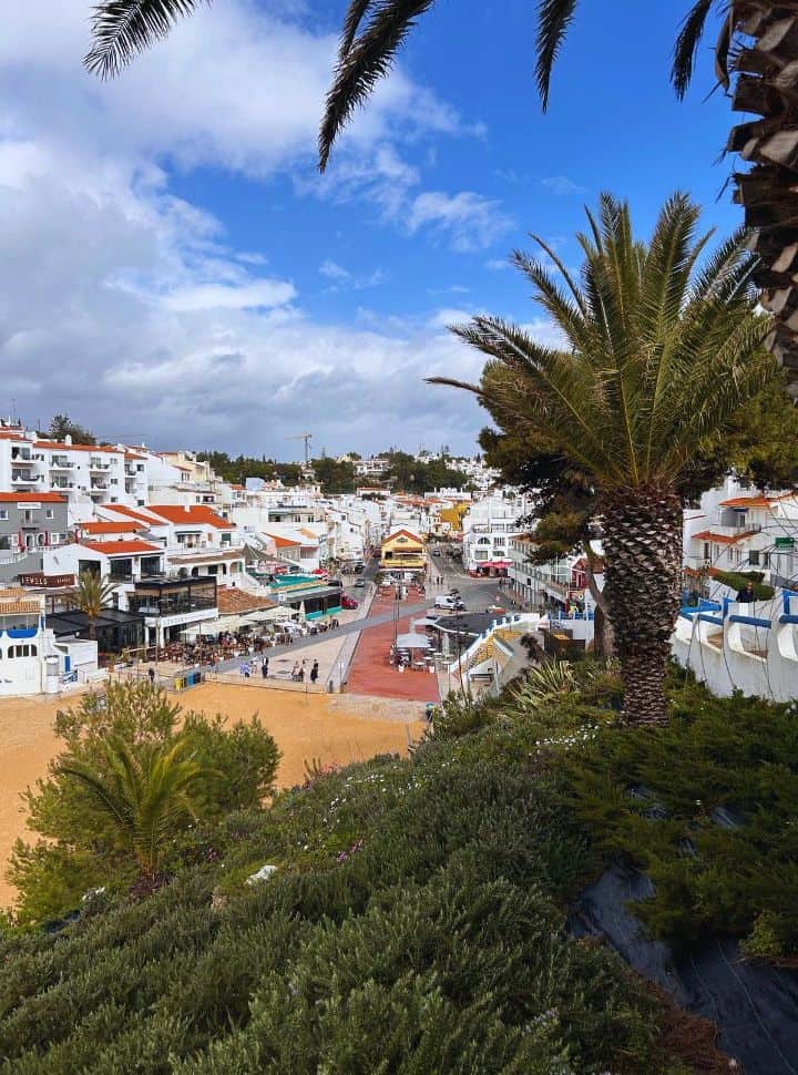 view of the streets, buildings and beach of carvoeiro algarve