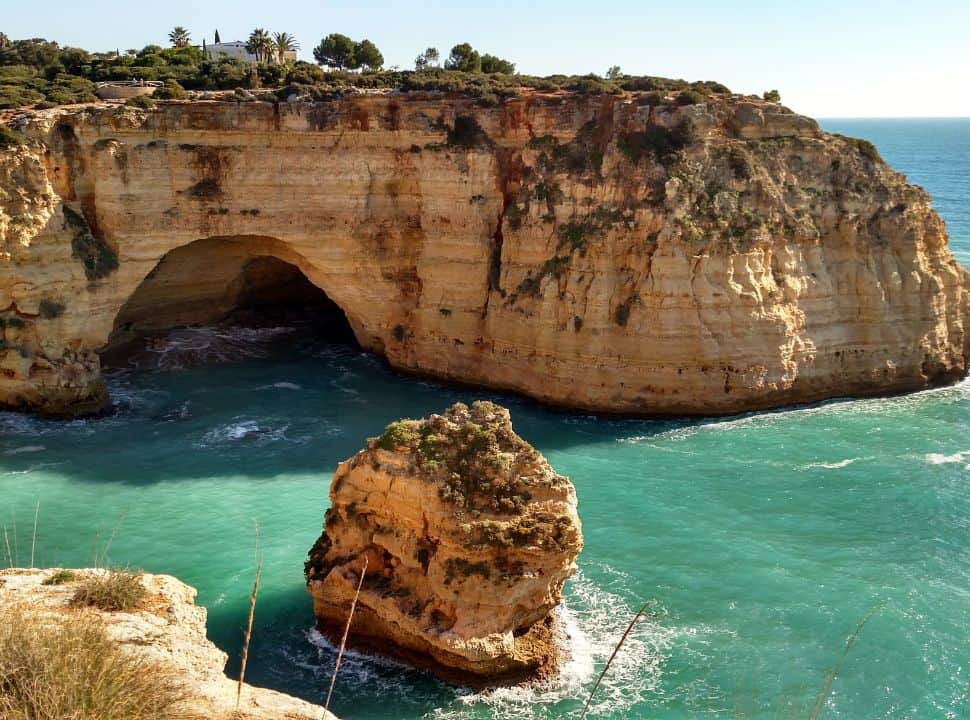 view of cave and cliffs at praia de vale covo near carvoeiro portugal