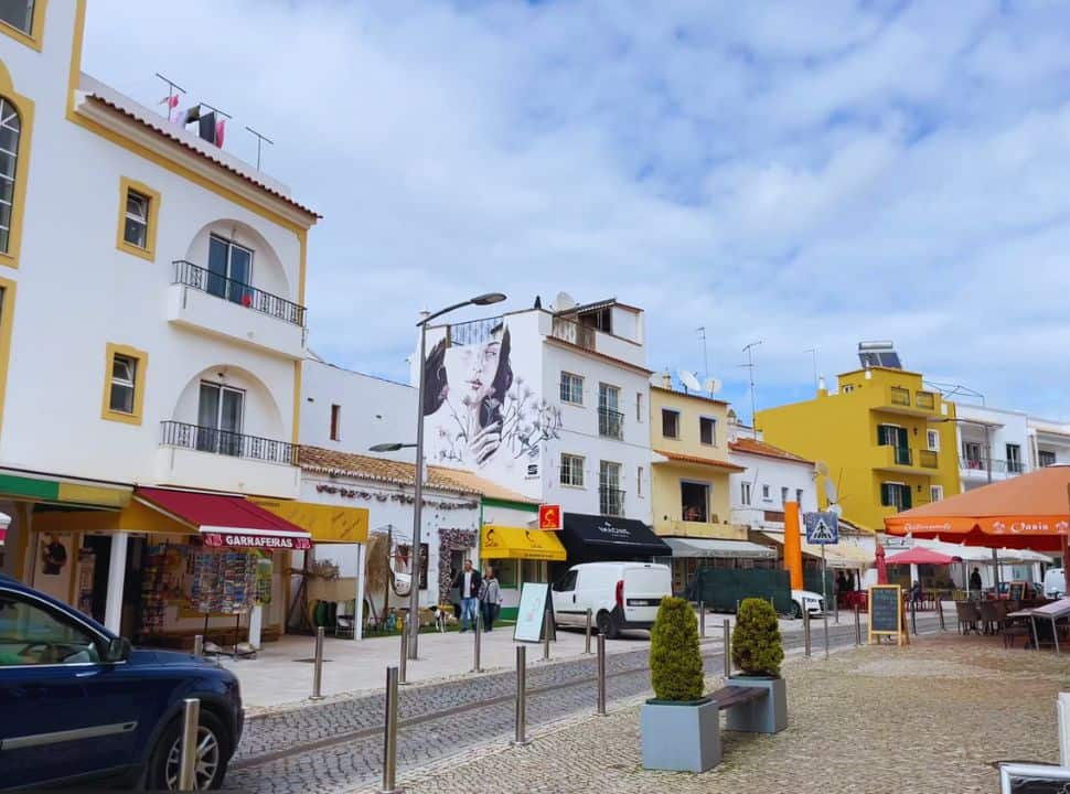 shops and restaurants along a street in carvoeiro lago
