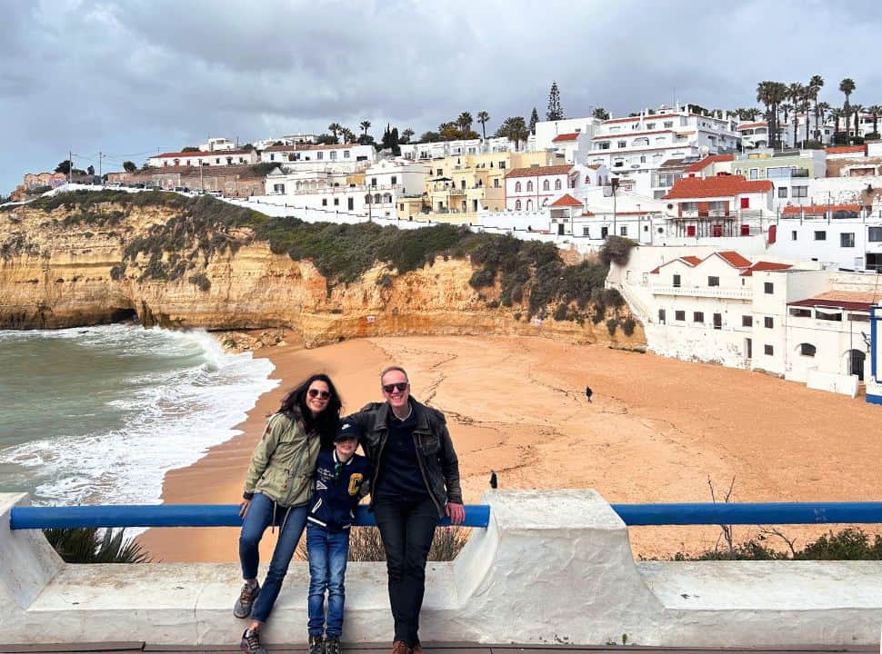 us posing in front of carvoeiro beach