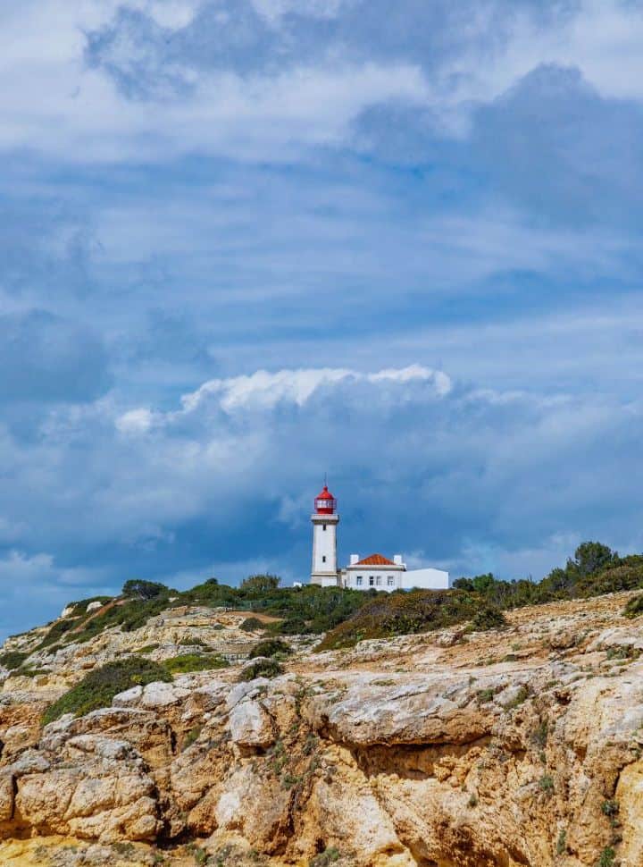 farol de alfanzina, beautiful lighthouse set on the cliffs just outside carvoeiro town portugal