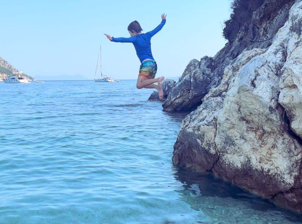 boy jumping from the cliffs