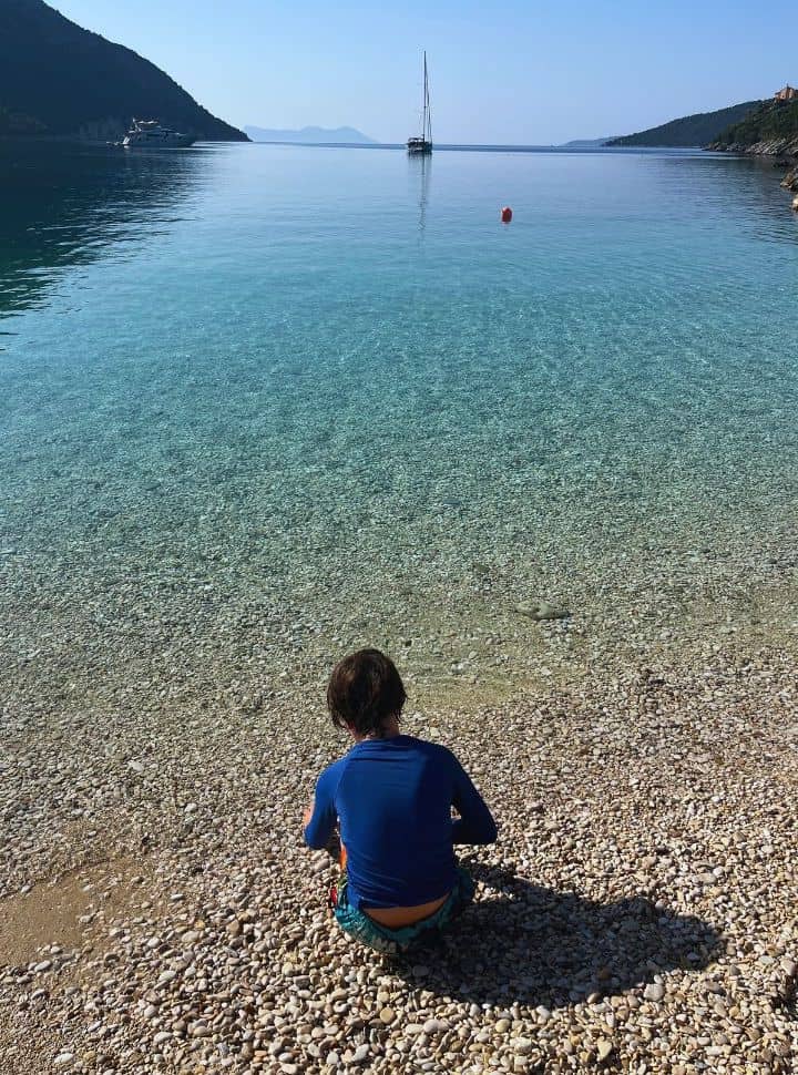view of boy playing in the clear water