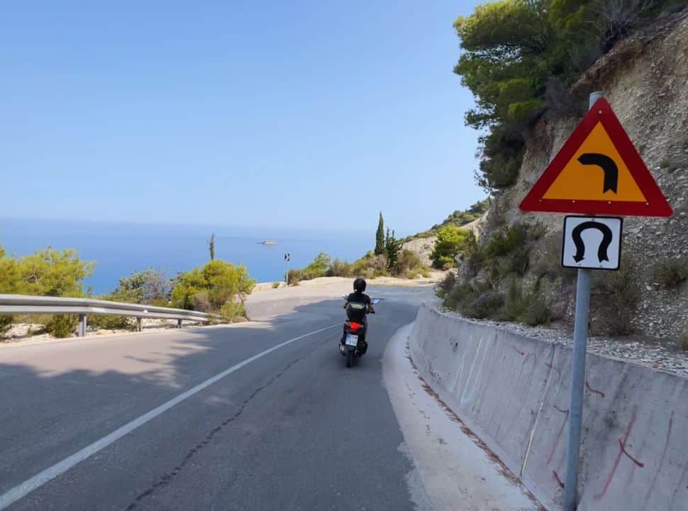 sign of a hair pin turn at a road to a beach of lefkada