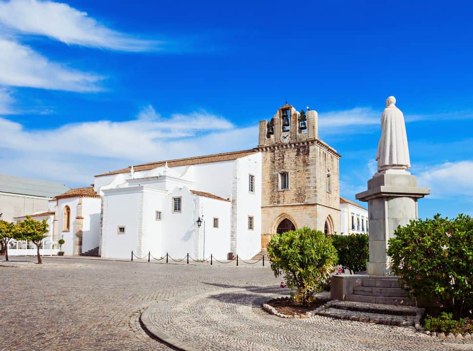 square with statue and church in faro