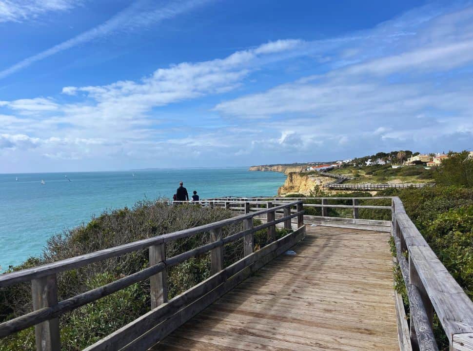 walking along the wooden boardwalk in Carvoeiro Portugal