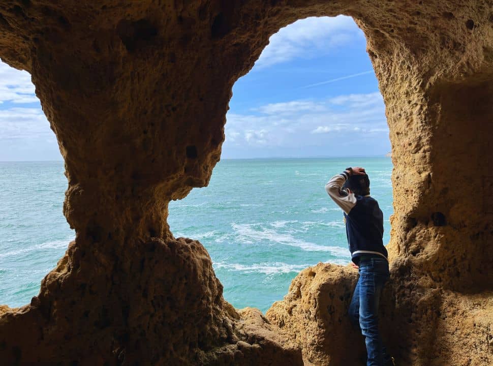 looking through the 'eyes' of the aboneca cave at algar seco portugal 