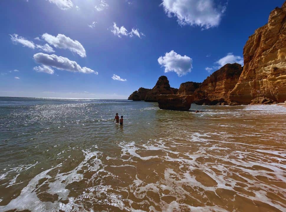 swimming at praia da marinha the algarve portugal