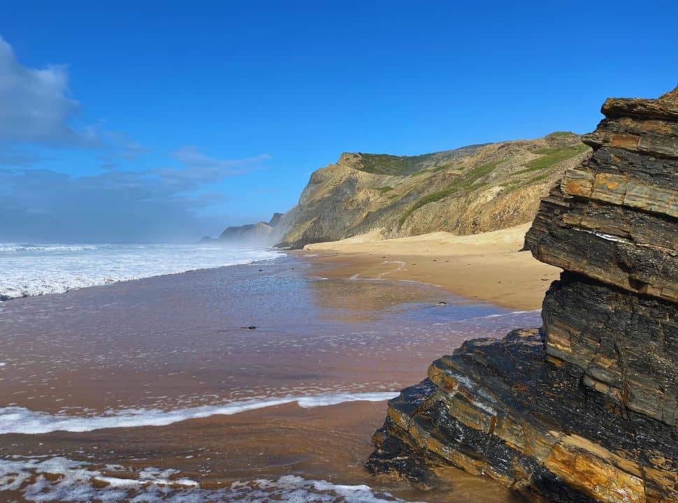 the rock layers are very visible at this part of the beach of Cordoama