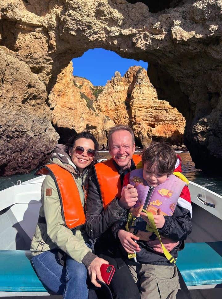 us in the small boat admiring the cliffs during the grotto tour lagos portugal