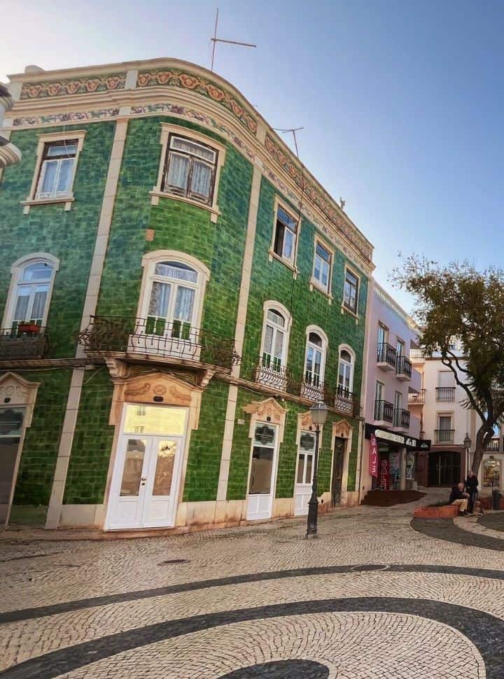 popular green building at a square in lagos portugal