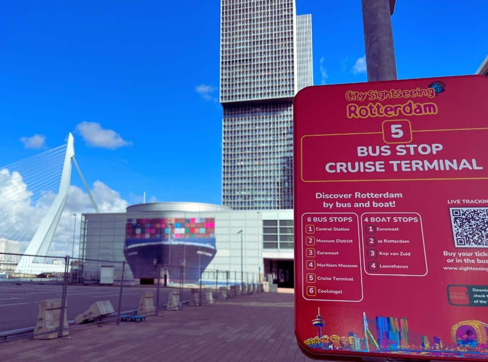 bustop number 5 of the city sightseeing bus Rotterdam with the Erasmus bridge and The Rotterdam building in the back