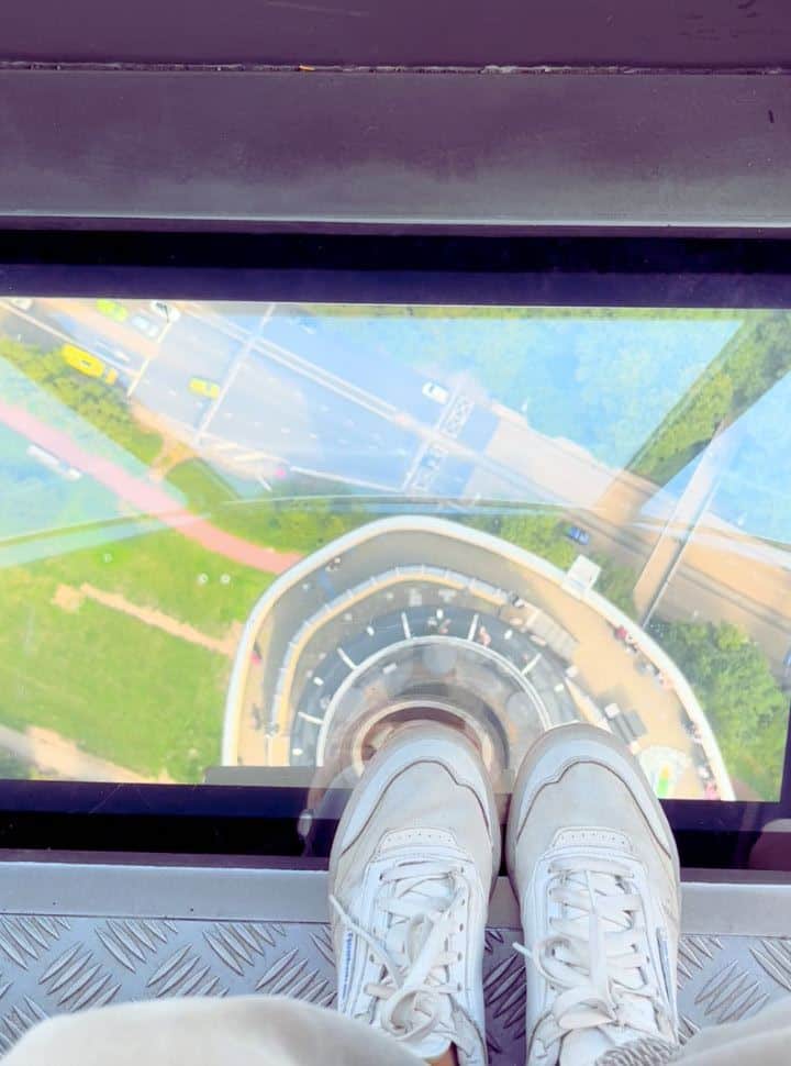 looking down through the glass floor of the Euroscoop on the top of the Euromast Rotterdam