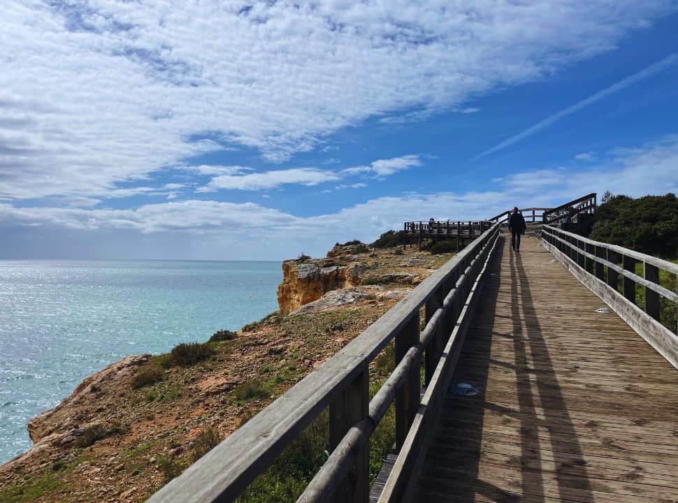 wooden boardwalk along the coast near Carvoeiro Portugal