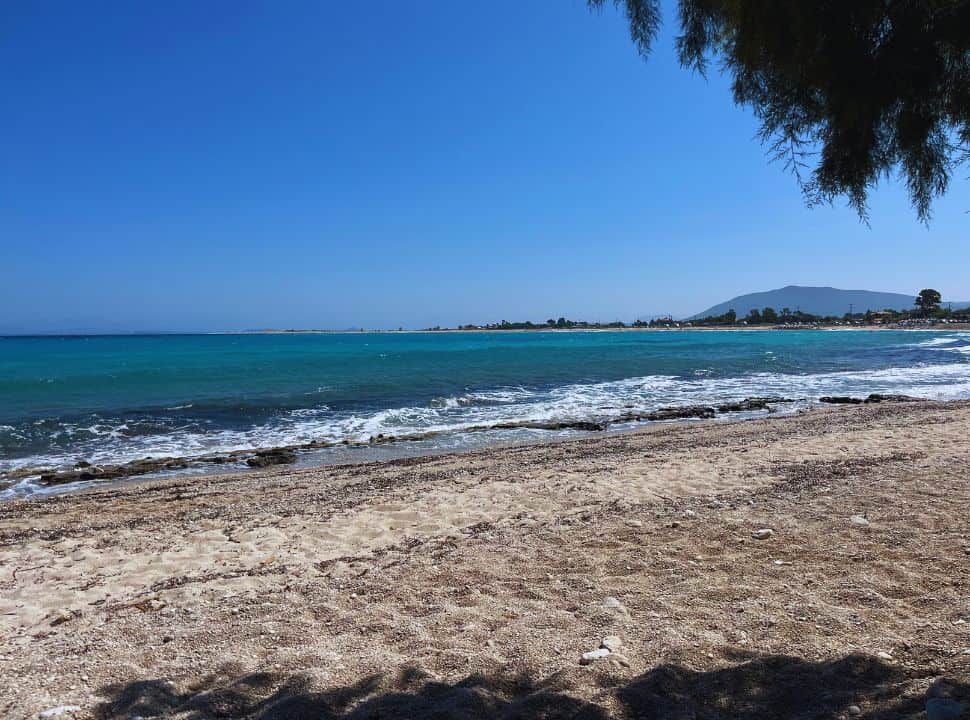 Empty beach with view of greek mainland in the far distance