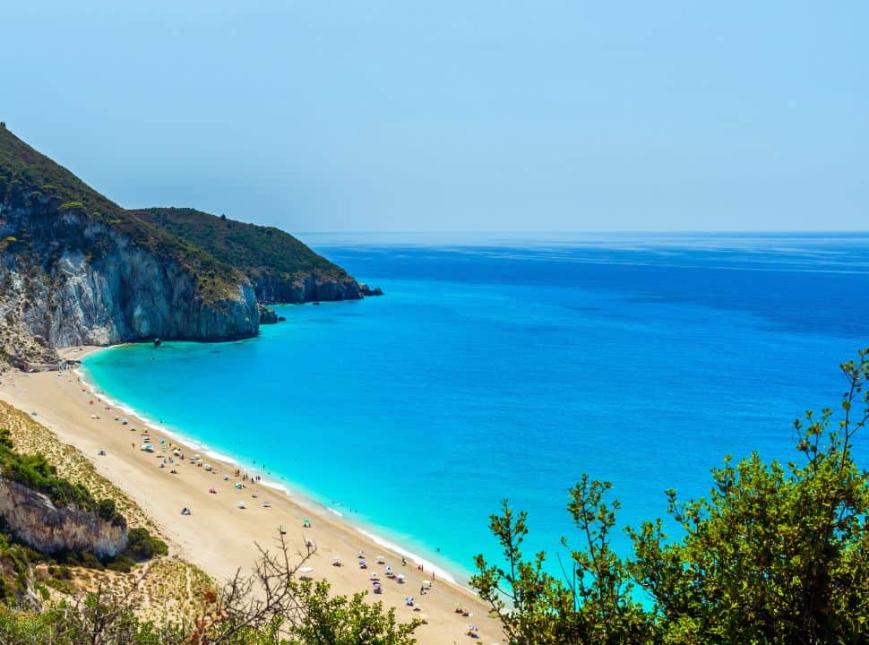 view of the long stretched Milos beach from the hills at Agios Nikitas village