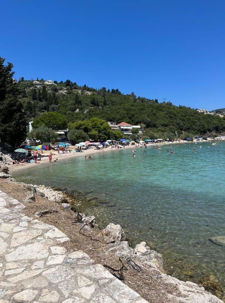 view of episkopis beach with clear water and a lot of people