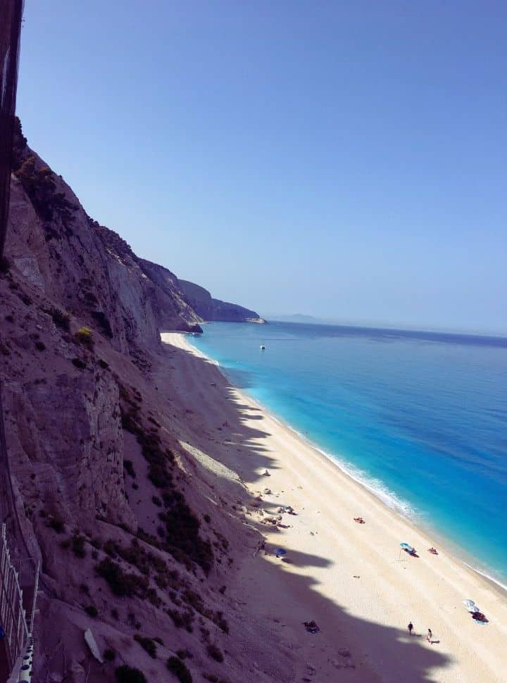 view from the stairs of Egremni beach with white sand and various shade of blue water