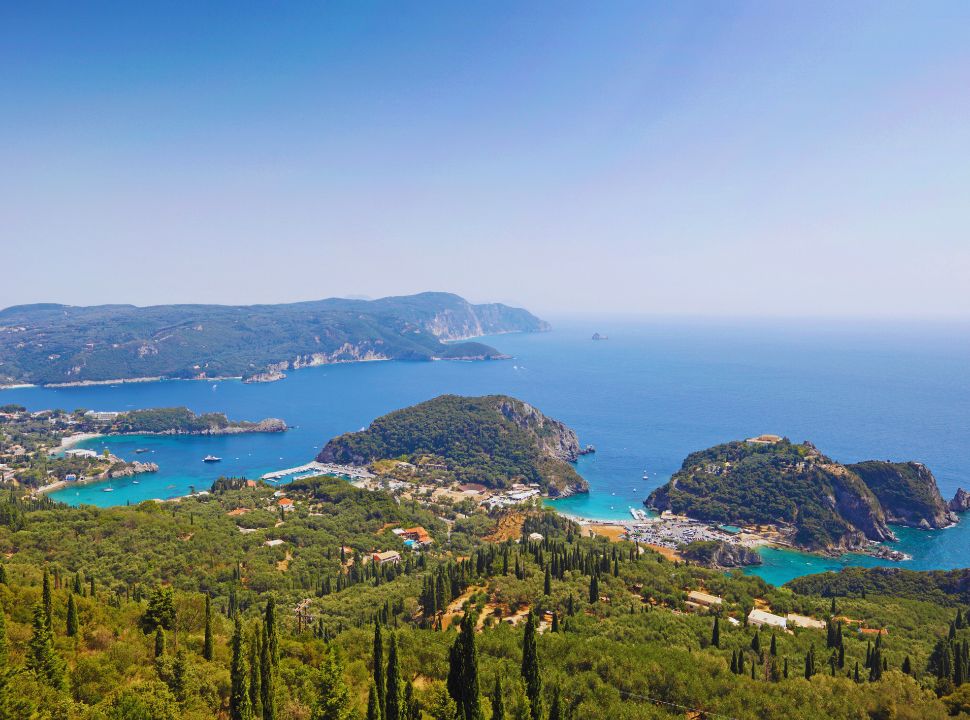 view of the many bays at paleokastritsa with accommodation, beaches and boats