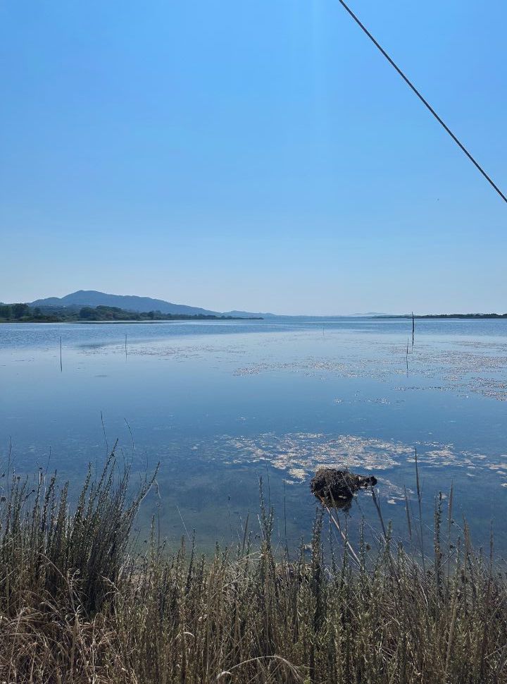 calm lake near by a halikones beach in corfu