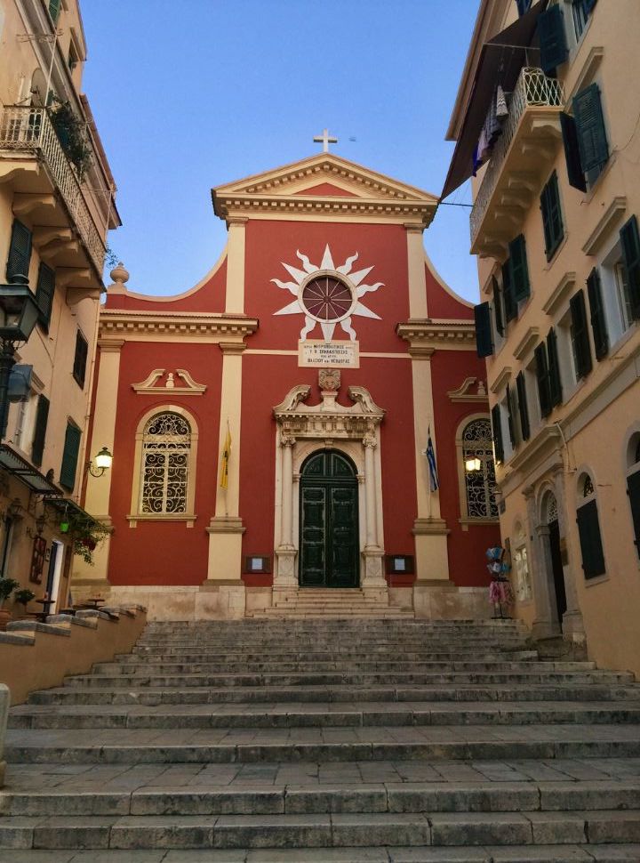 the striking red panagia antivouniotissa church in corfu town