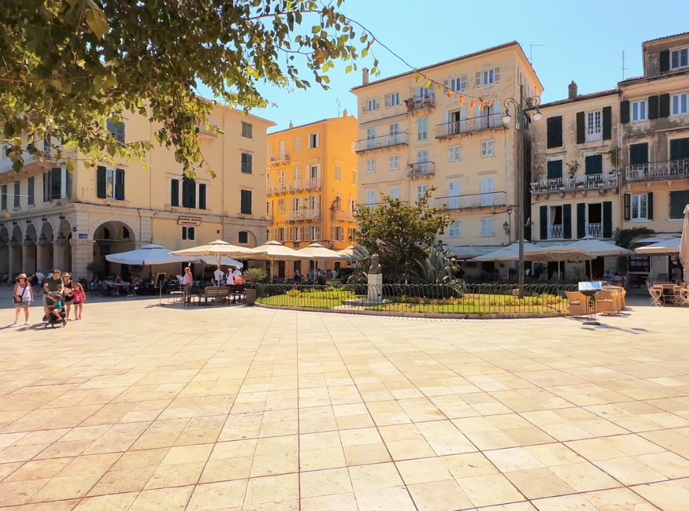 a square located next to the liston with many historical buildings in corfu town