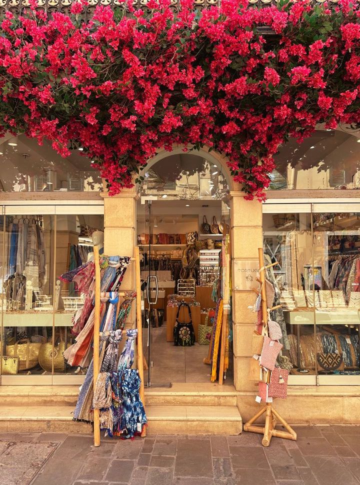 boutique decorated with colourful red flowers