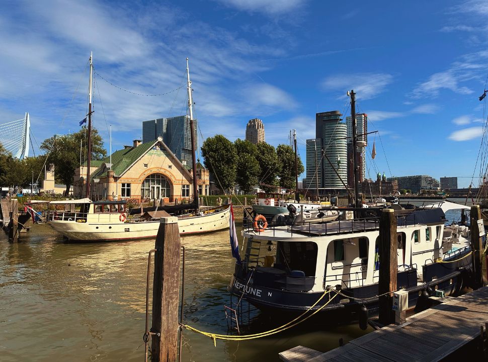 boats and harbor house along the river Maas in Rotterdam