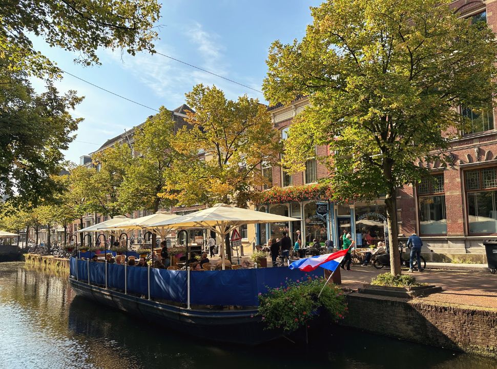 a boat terrace at the canal in delft 