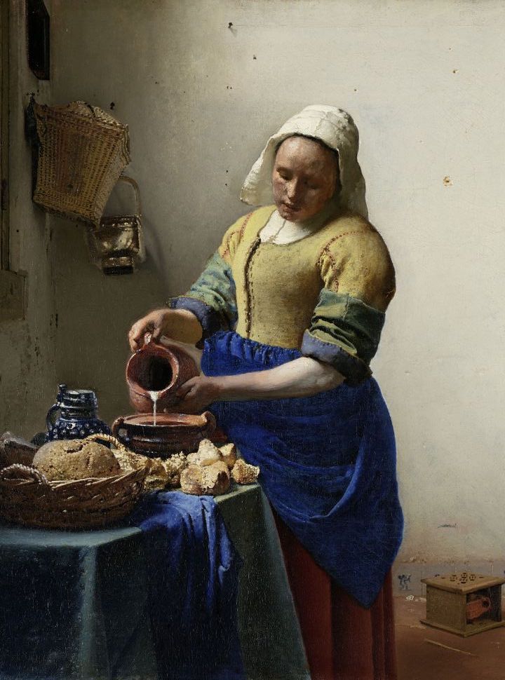 vermeer painting of a woman pouring milk into a bowl