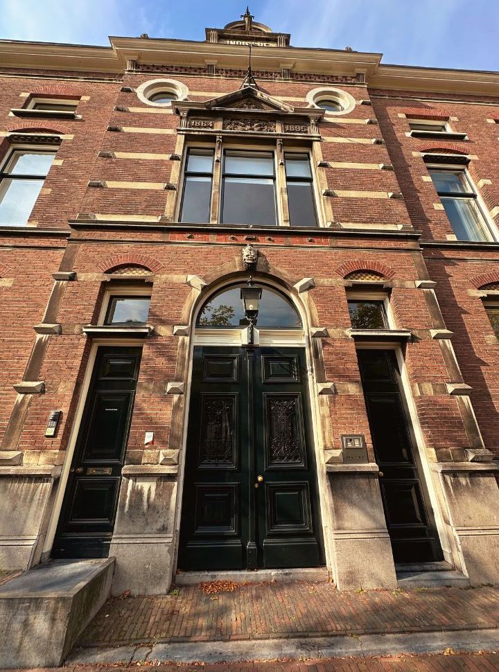 historic building with large doors and windows in delft the netherlands