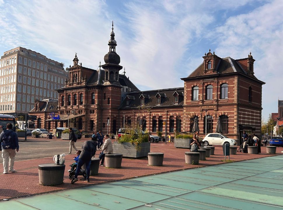 historic delft train station building located at a square