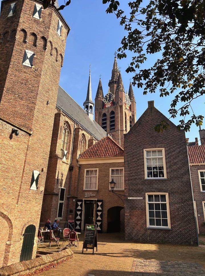 historic building and tower in which the museum is located. Behind the building you can see the leaning tower of the old church in delft