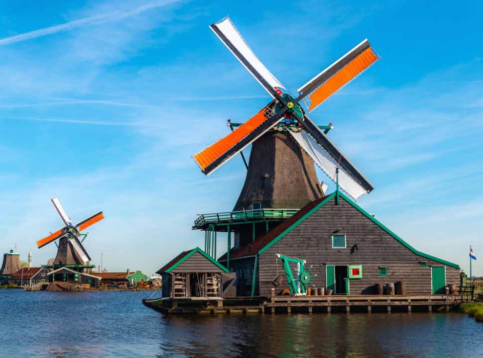 two windmills at the water at the Zaanse Schans in the Netherlands