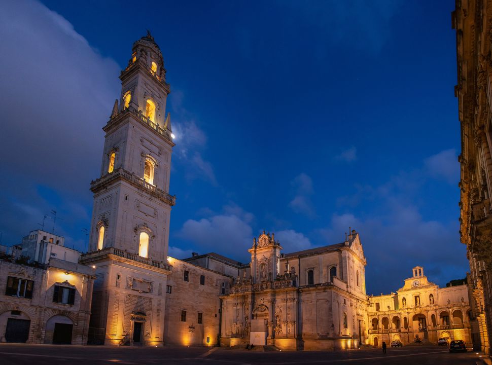 building in Lecce lit beautifully by night