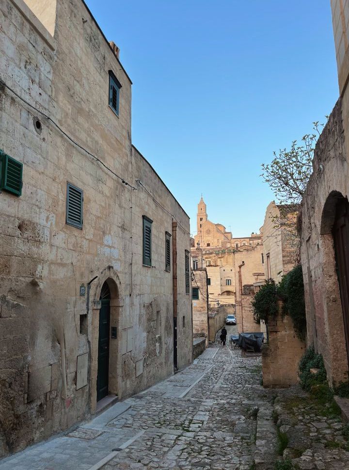 narrow cobbled street with stone houses in Matera Italy