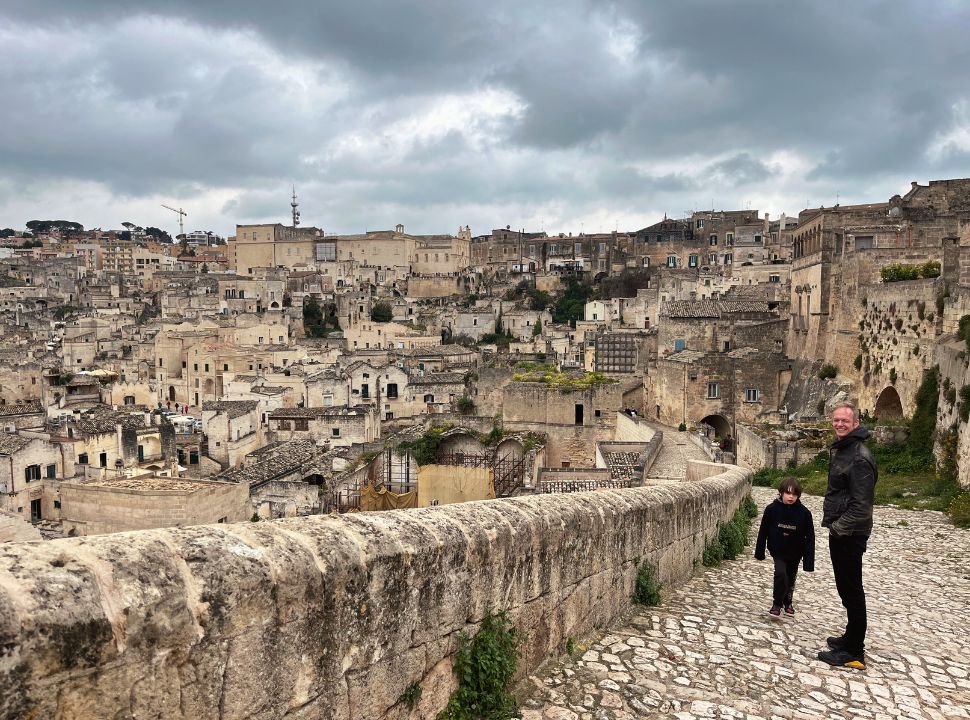 father and son walking down the stairs to the Sassi neighbourhood in Matera