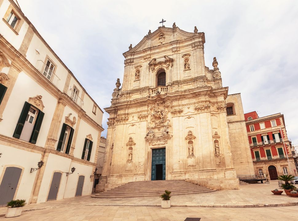 beautiful church with a flight of stairs leading to the entrance in the center of town Martina Franca Puglia