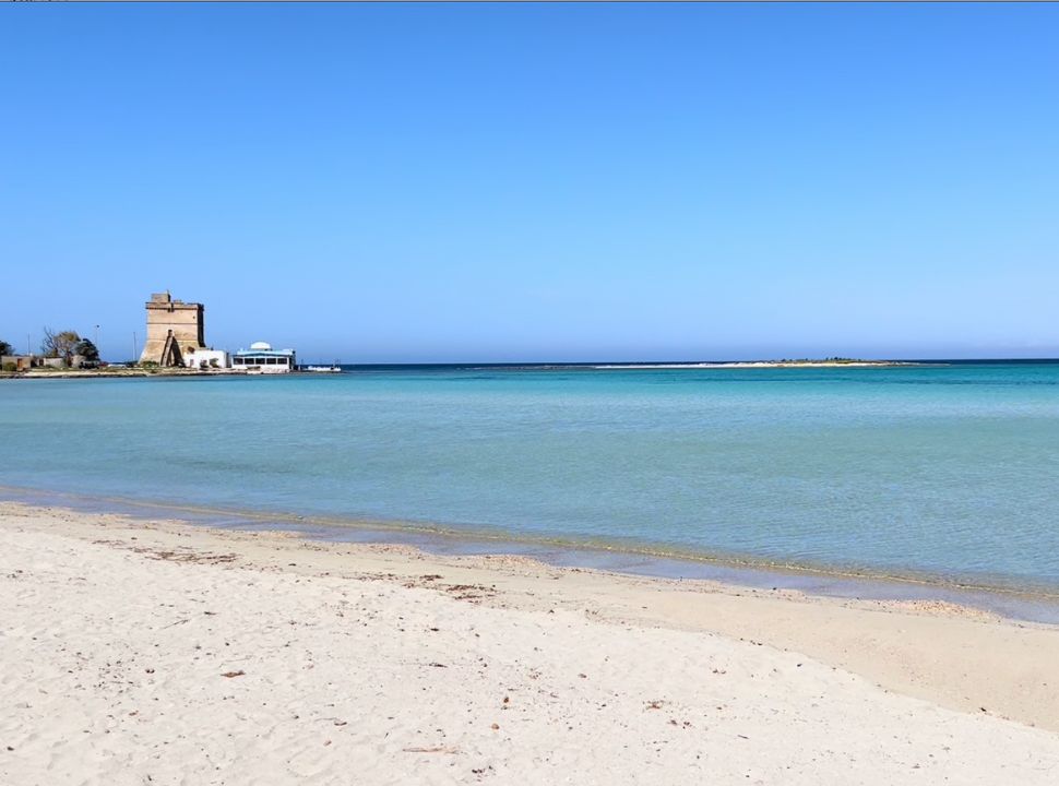 one of the many beaches with incredable blue and clear water along the coastal road in Salento Puglia