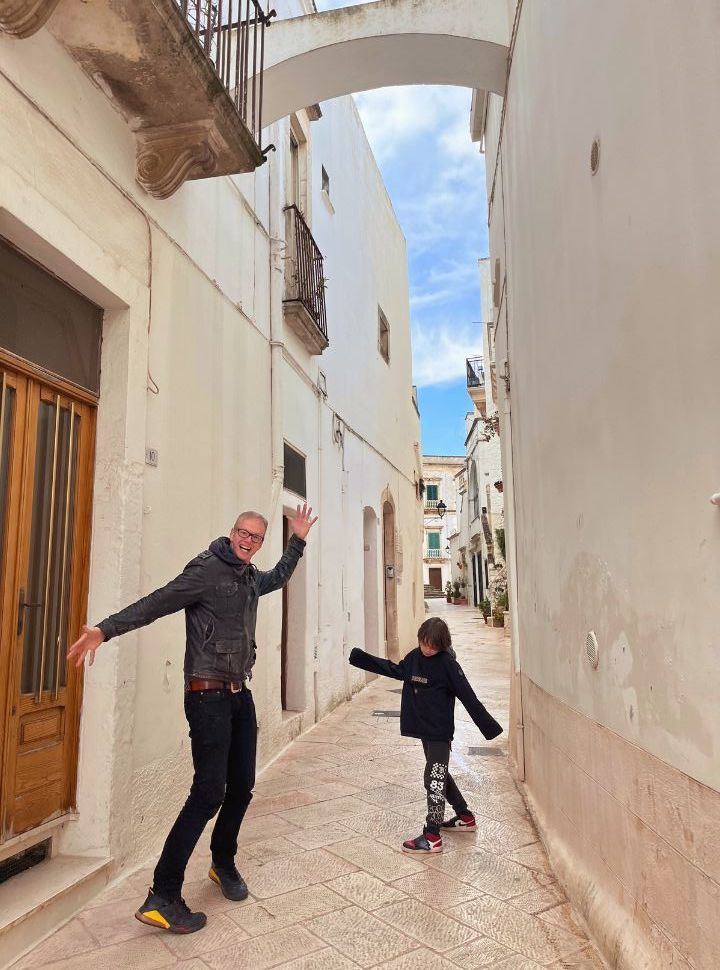 walking through the empty streets in the low season at Locorotondo Puglia Italy