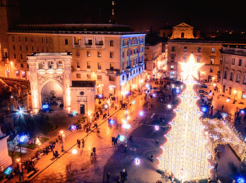 huge christmas tree and buildings illuminated along a square in Lecce Puglia