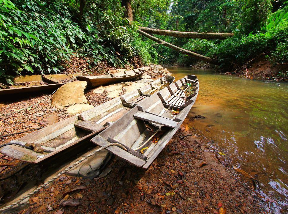 canoes on the edge of the river in Sarawak Malaysia
