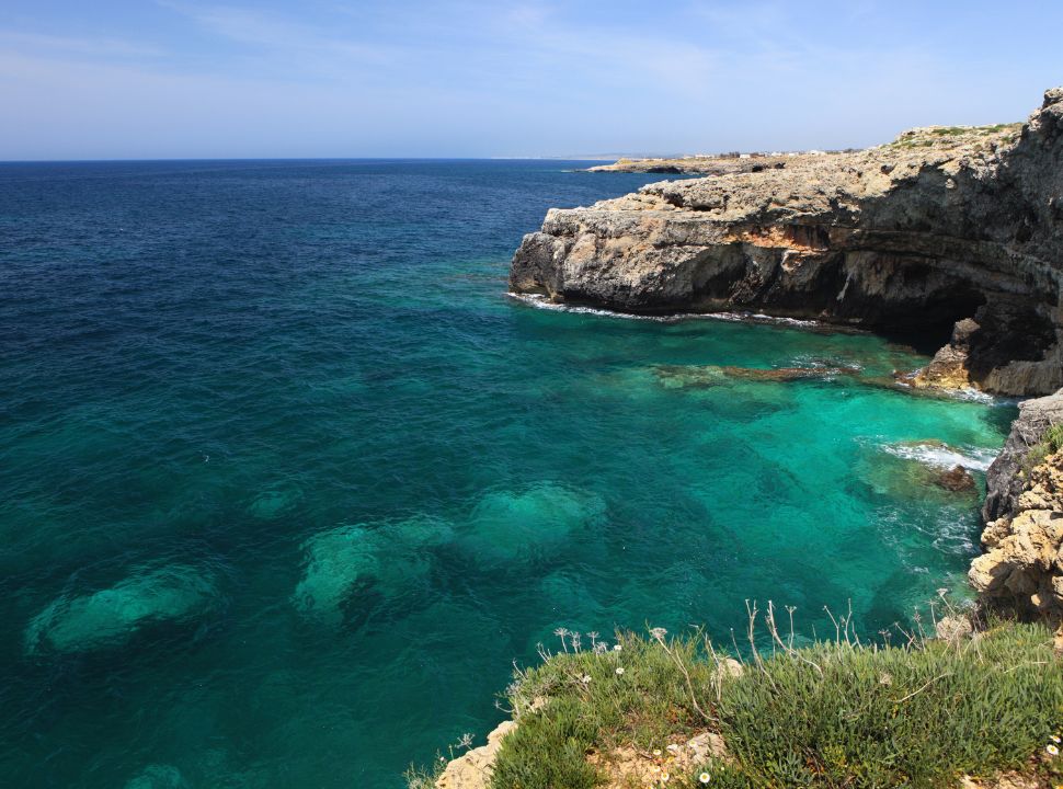 stunning turquoise water along the cliffs and caves in south Puglia Italy 