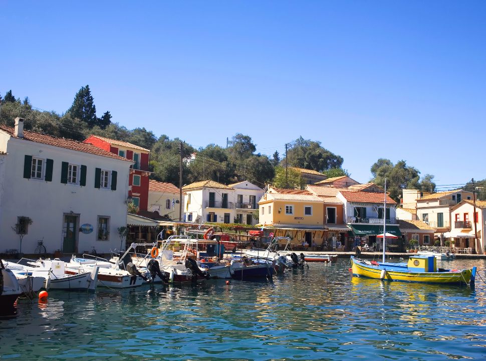 harbour with colourfu houses and many litlle boats docked at paxos island, near corfu island