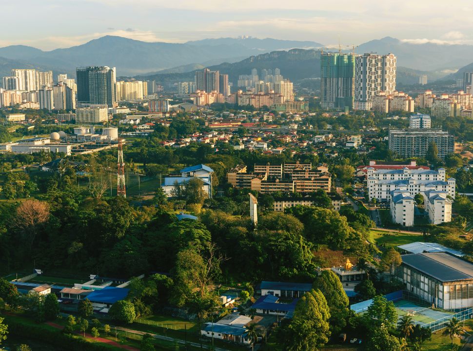 view of kuala lumpur with the high towers of city center and outskirt neigbourhoods surrounding it