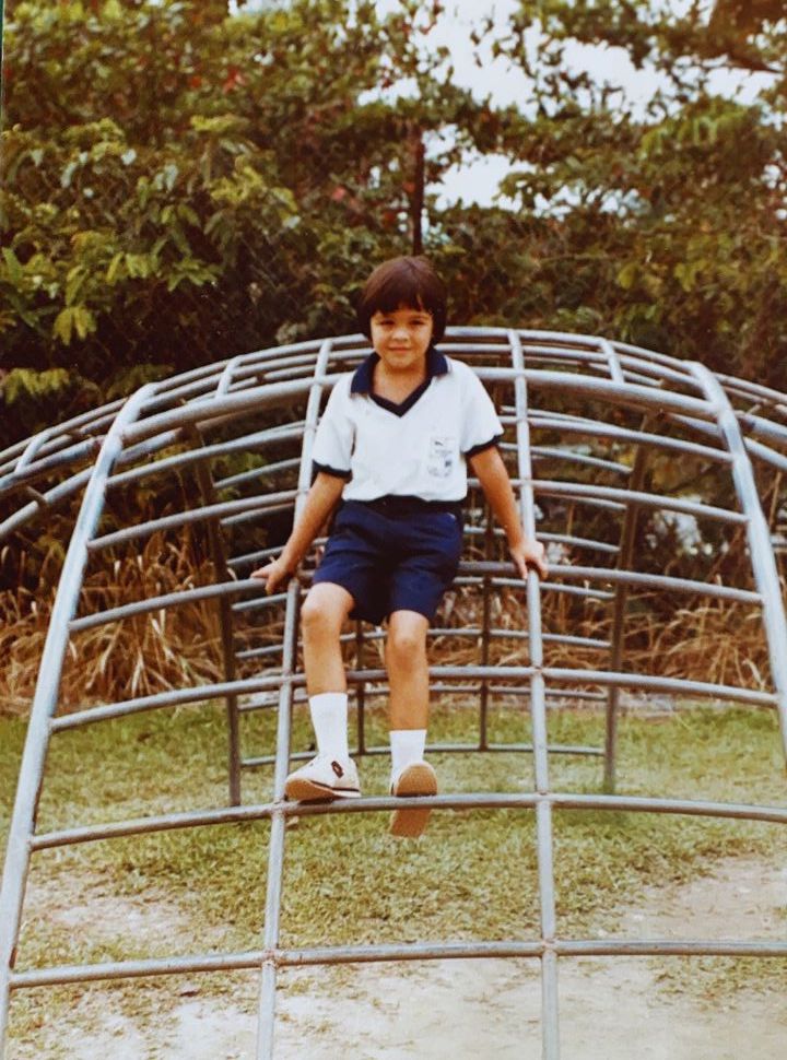 old picture of a girl wearing a school uniform
