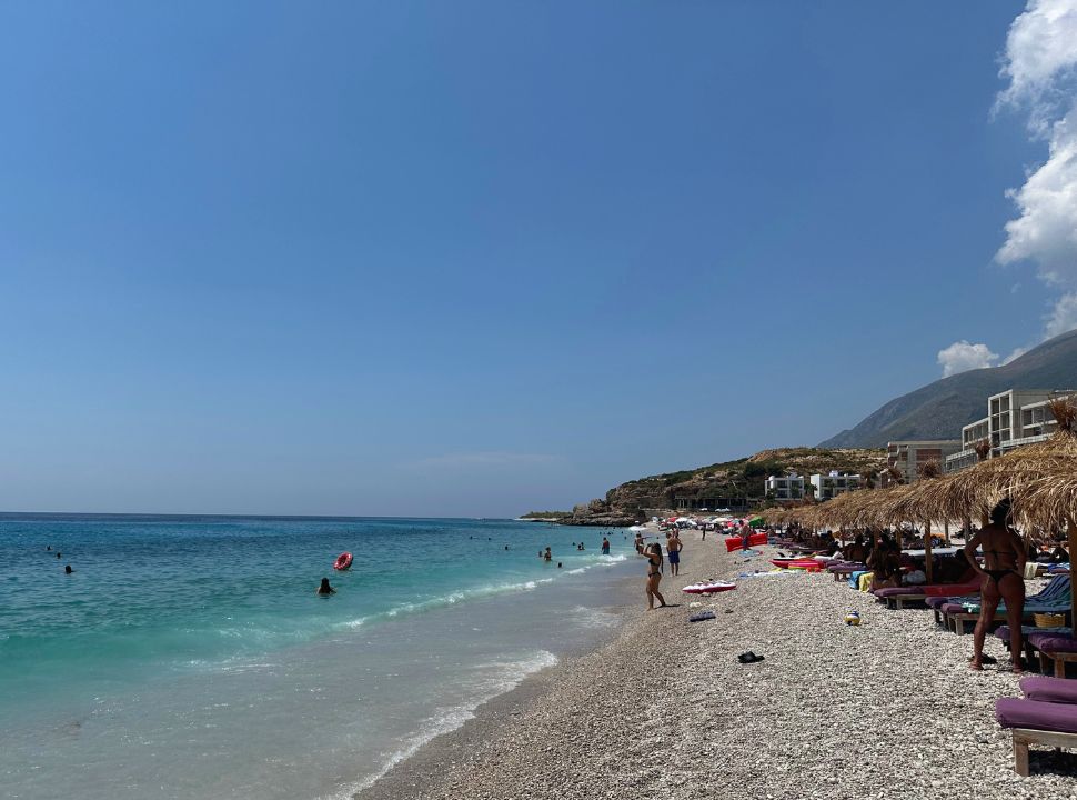 sun loungers along a beach with stunning water near Dhermi Albani