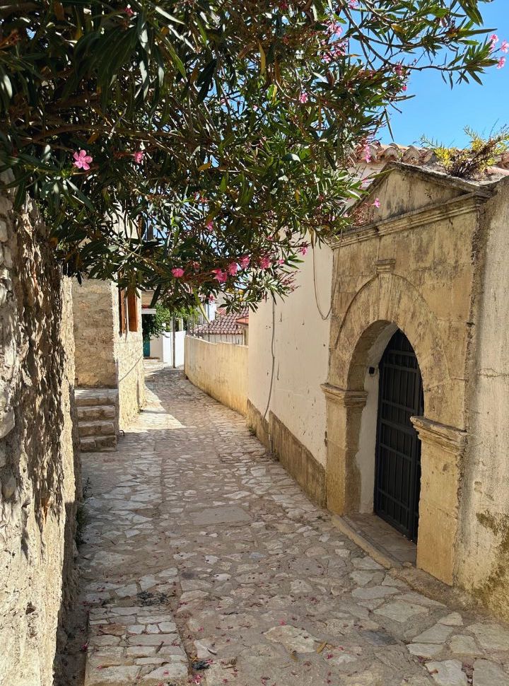 typical cobbled street with old walls in dhermi town Albania